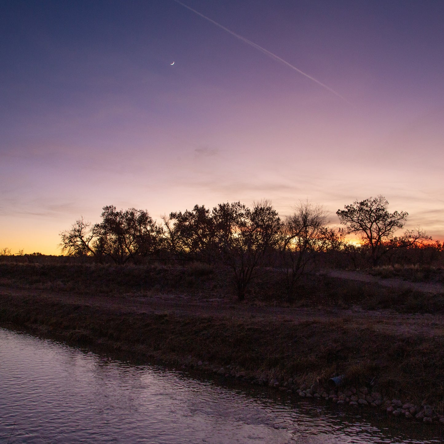 Purple Skies over Clear Ditch at Sunset Looking West